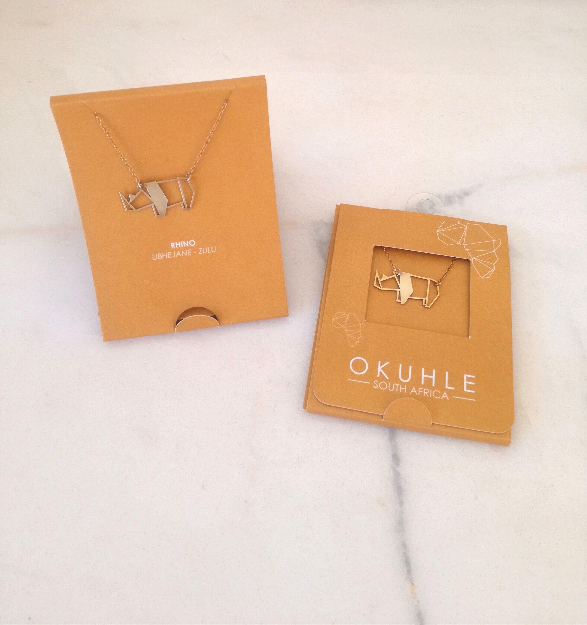 OKUHLE Rhino pendant & necklace - packaging