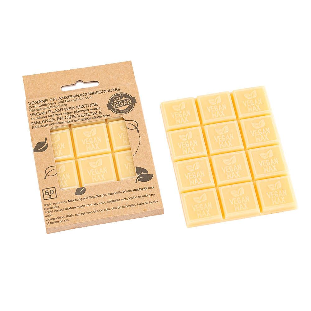 A packaged set of yellow rectangular vegan wax refresh cubes, with product information visible on the packaging.